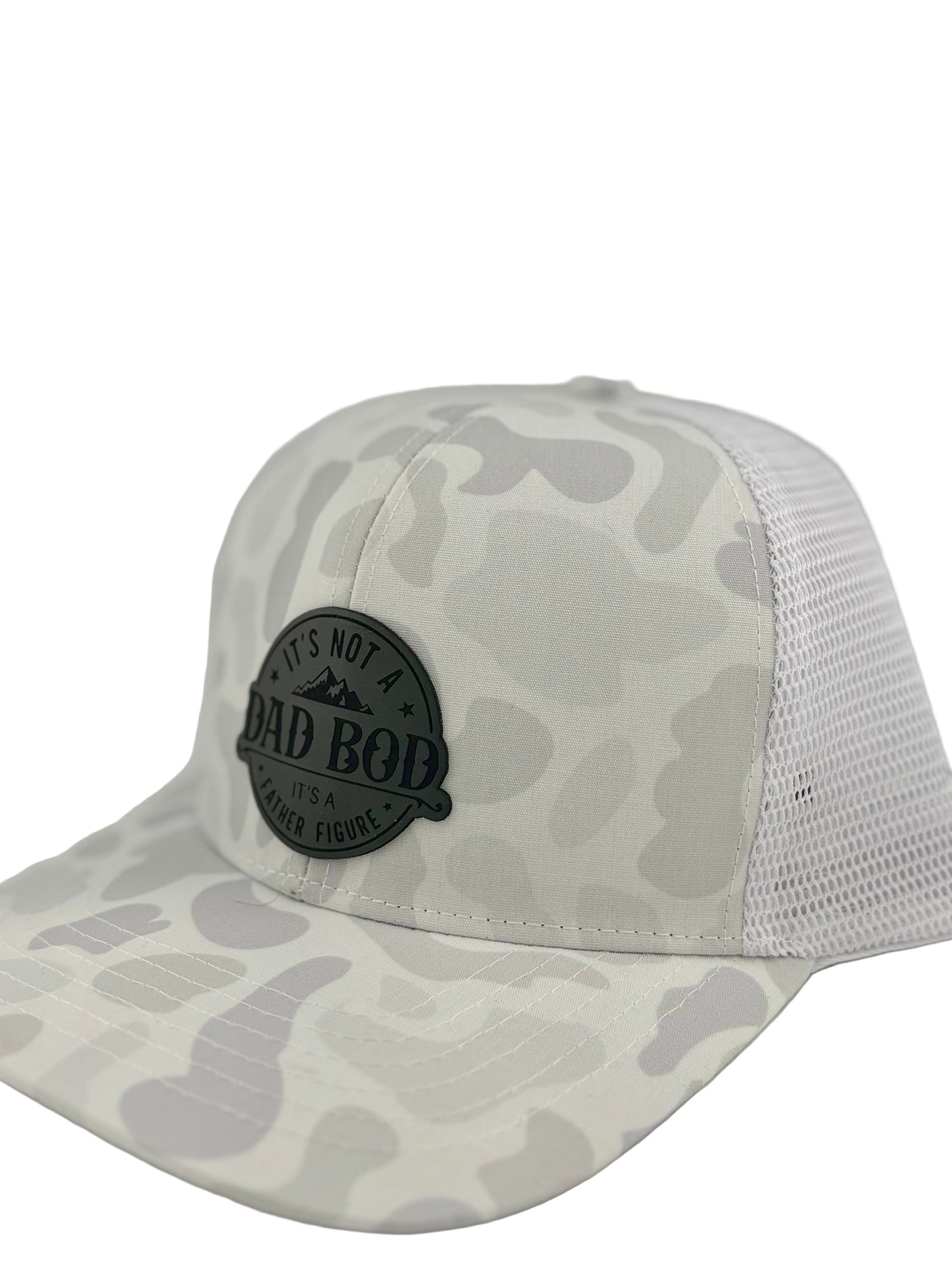 "Side view of a white camo trucker hat with a white mesh back and structured front panel. The black circular patch featuring 'IT'S NOT A DAD BOD, IT'S A FATHER FIGURE' and a mountain design adds a bold yet stylish statement for dads. The neutral colors make it a versatile accessory."